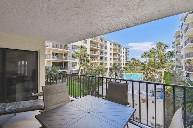 balcony featuring outdoor dining area