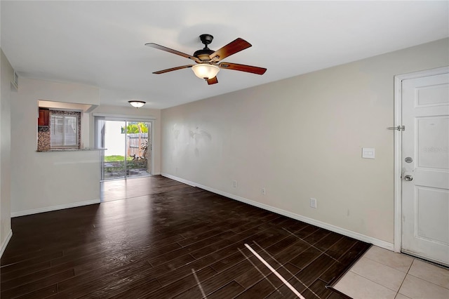 3206 W Azeele St Unit 126, Tampa, FL 33609 - spare room featuring ceiling fan, wood finished floors, and baseboards