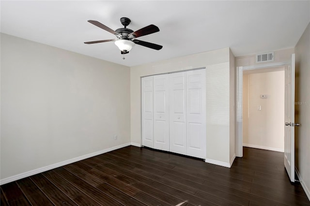 3206 W Azeele St Unit 126, Tampa, FL 33609 - unfurnished bedroom with dark wood-style flooring, a closet, baseboards, and ceiling fan