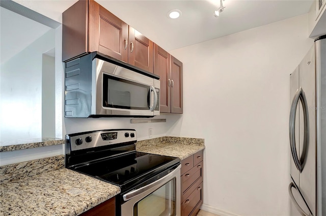 3206 W Azeele St Unit 126, Tampa, FL 33609 - kitchen featuring stainless steel appliances and light stone countertops