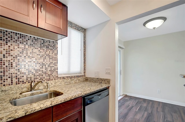 3206 W Azeele St Unit 126, Tampa, FL 33609 - kitchen featuring stainless steel dishwasher, a sink, backsplash, and dark wood-style flooring