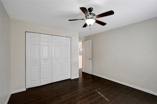 3206 W Azeele St Unit 126, Tampa, FL 33609 - unfurnished bedroom with dark wood-style floors, baseboards, a closet, and a ceiling fan