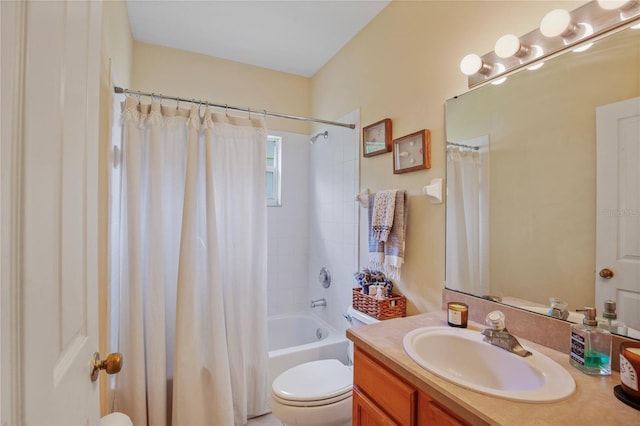 bathroom with shower / tub combo with curtain, toilet, and vanity