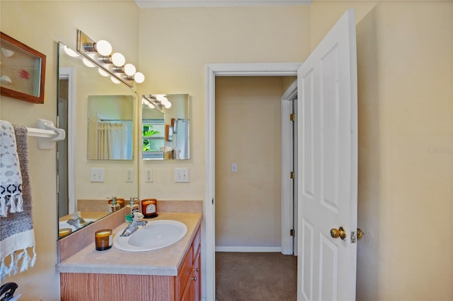 bathroom with baseboards and vanity