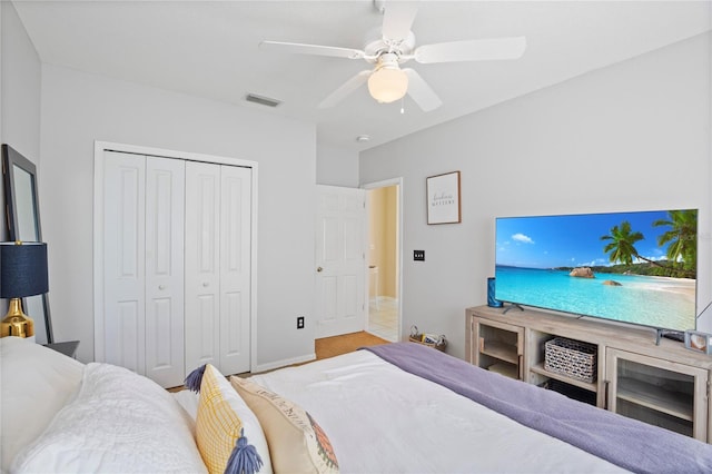 bedroom with a closet, visible vents, and a ceiling fan