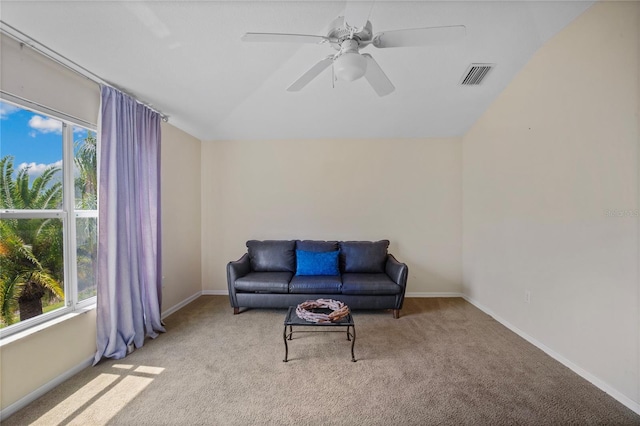 sitting room featuring a wealth of natural light, visible vents, carpet floors, and baseboards