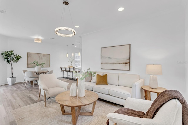 2410 W N A St Unit 2, Tampa, FL 33609 - living area with a notable chandelier, baseboards, recessed lighting, light wood-style flooring, and visible vents