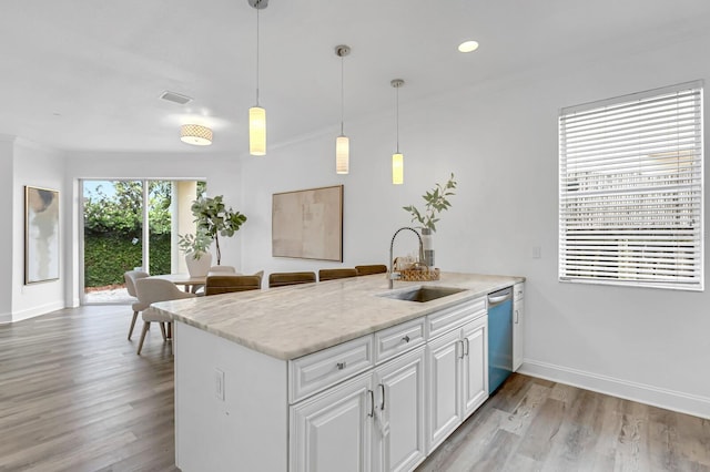 2410 W N A St Unit 2, Tampa, FL 33609 - kitchen featuring light wood-type flooring, white cabinetry, visible vents, dishwasher, and a sink