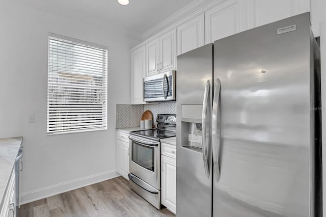 2410 W N A St Unit 2, Tampa, FL 33609 - kitchen featuring light countertops, white cabinetry, and stainless steel appliances