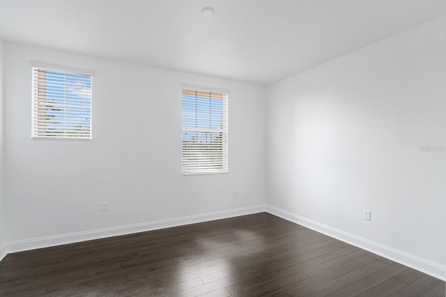 2410 W N A St Unit 2, Tampa, FL 33609 - empty room featuring a wealth of natural light, baseboards, and dark wood finished floors