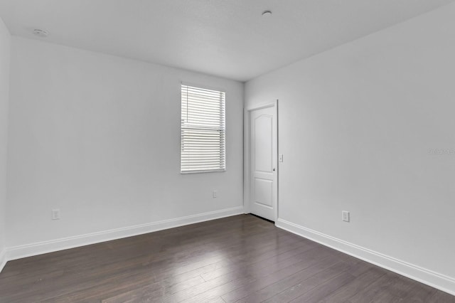 2410 W N A St Unit 2, Tampa, FL 33609 - empty room with dark wood-type flooring and baseboards