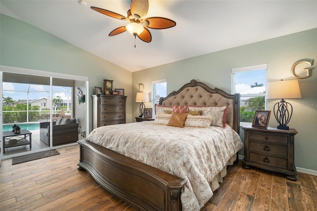121 Colonial St SW, Port Charlotte, FL 33952 - bedroom featuring multiple windows, access to exterior, and wood finished floors