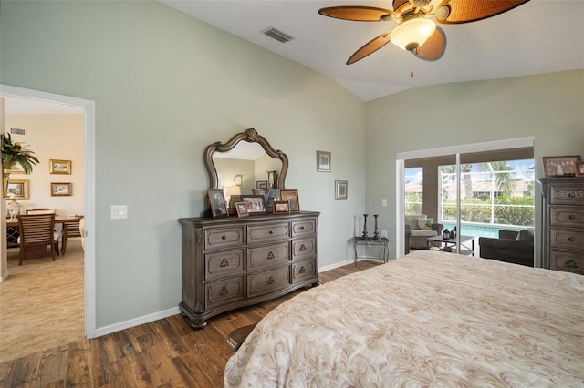 121 Colonial St SW, Port Charlotte, FL 33952 - bedroom featuring access to exterior, vaulted ceiling, baseboards, visible vents, and dark wood-style flooring