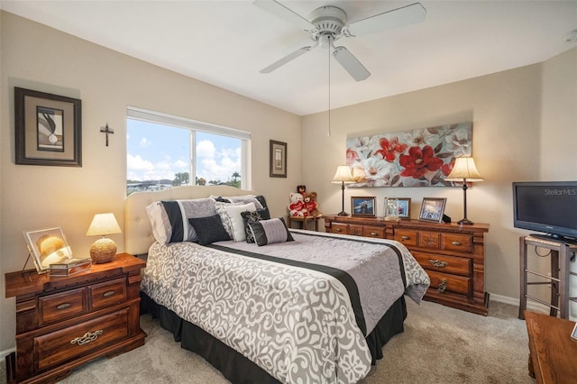 121 Colonial St SW, Port Charlotte, FL 33952 - bedroom with a ceiling fan, light carpet, and baseboards
