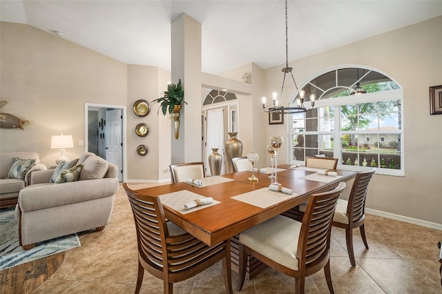 121 Colonial St SW, Port Charlotte, FL 33952 - dining room with baseboards, high vaulted ceiling, light tile patterned floors, and an inviting chandelier