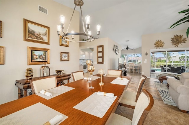 121 Colonial St SW, Port Charlotte, FL 33952 - tiled dining area featuring ceiling fan with notable chandelier and visible vents