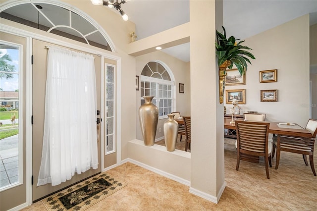 121 Colonial St SW, Port Charlotte, FL 33952 - foyer entrance with light tile patterned flooring and baseboards