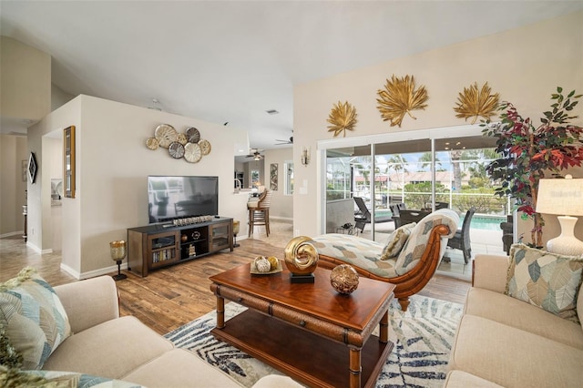 121 Colonial St SW, Port Charlotte, FL 33952 - living area with a ceiling fan, baseboards, and wood finished floors