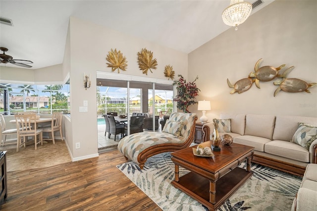 121 Colonial St SW, Port Charlotte, FL 33952 - living area featuring high vaulted ceiling, baseboards, visible vents, ceiling fan, and wood finished floors