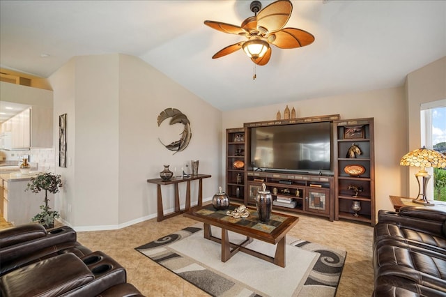 121 Colonial St SW, Port Charlotte, FL 33952 - living room with light carpet, baseboards, lofted ceiling, and ceiling fan