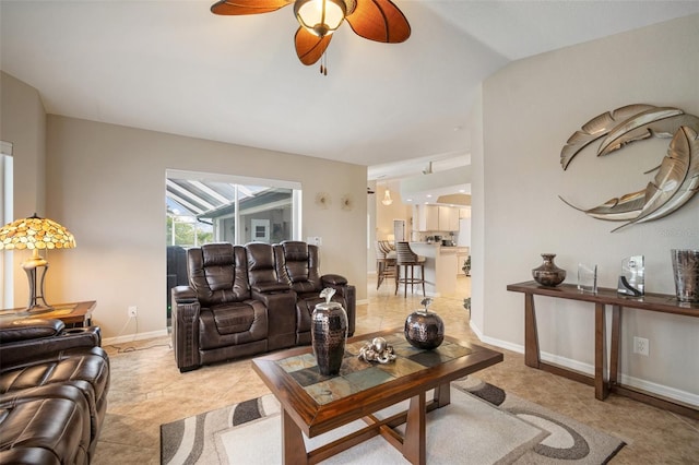 121 Colonial St SW, Port Charlotte, FL 33952 - living area featuring baseboards, tile patterned flooring, and a ceiling fan