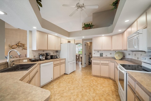 121 Colonial St SW, Port Charlotte, FL 33952 - kitchen featuring white appliances, light brown cabinetry, and a sink