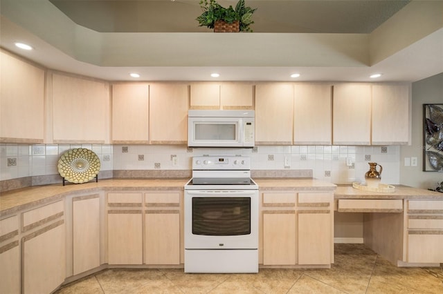 121 Colonial St SW, Port Charlotte, FL 33952 - kitchen featuring light countertops, white appliances, light tile patterned floors, backsplash, and light brown cabinets