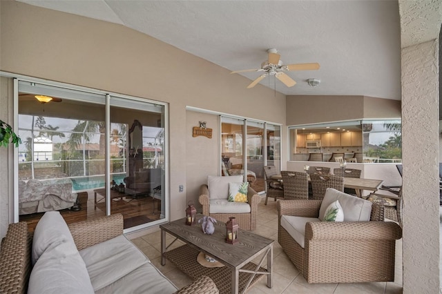 121 Colonial St SW, Port Charlotte, FL 33952 - exterior space featuring a ceiling fan, exterior kitchen, and an outdoor living space