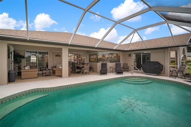 121 Colonial St SW, Port Charlotte, FL 33952 - outdoor pool featuring a grill, glass enclosure, and a patio