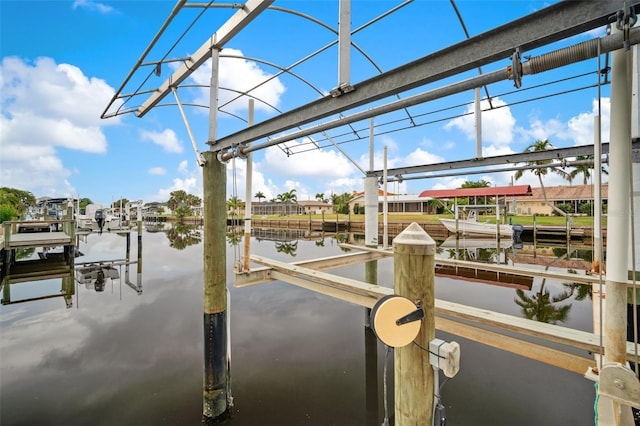 121 Colonial St SW, Port Charlotte, FL 33952 - dock area featuring a water view and boat lift
