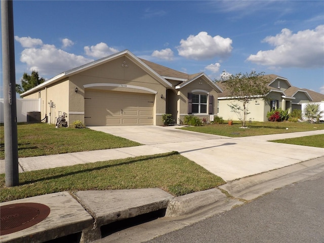 ranch-style house with a garage, driveway, a front yard, and stucco siding