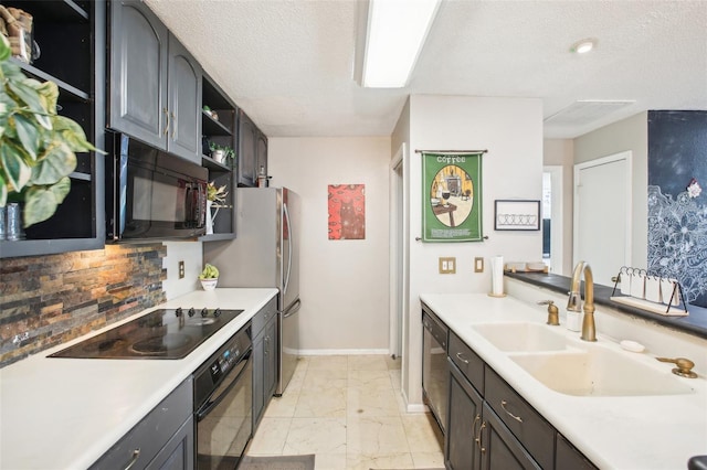 9481 Highland Oak Dr Unit 1616, Tampa, FL 33647 - kitchen with black appliances, a sink, open shelves, decorative backsplash, and light countertops