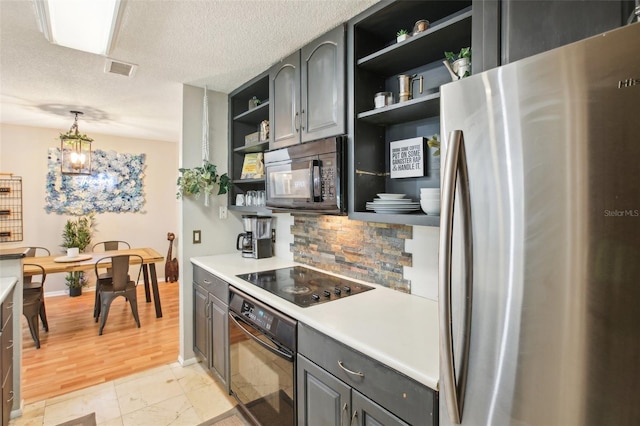 9481 Highland Oak Dr Unit 1616, Tampa, FL 33647 - kitchen featuring black appliances, open shelves, gray cabinets, decorative backsplash, and light countertops