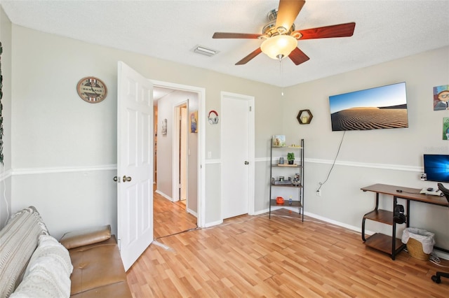 9481 Highland Oak Dr Unit 1616, Tampa, FL 33647 - home office with light wood finished floors, a ceiling fan, and baseboards