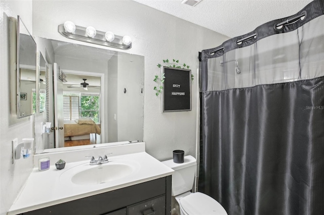 9481 Highland Oak Dr Unit 1616, Tampa, FL 33647 - full bathroom with vanity, ensuite bath, toilet, a shower with curtain, and a textured ceiling