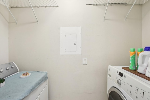 9481 Highland Oak Dr Unit 1616, Tampa, FL 33647 - laundry area featuring washer and clothes dryer and electric panel