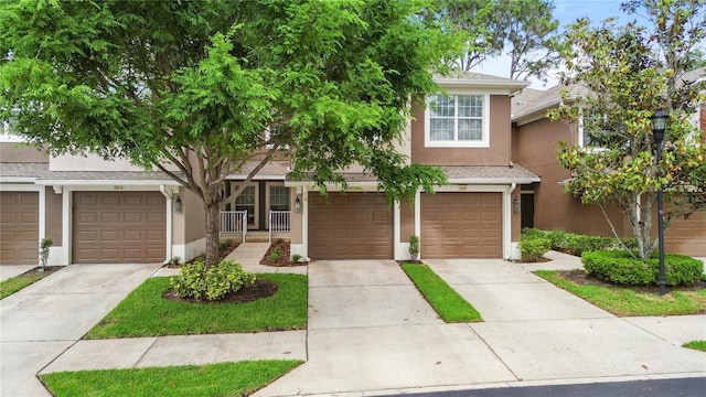 2009 River Turia Cir, Riverview, FL 33578 - view of front facade with a garage, stucco siding, and driveway