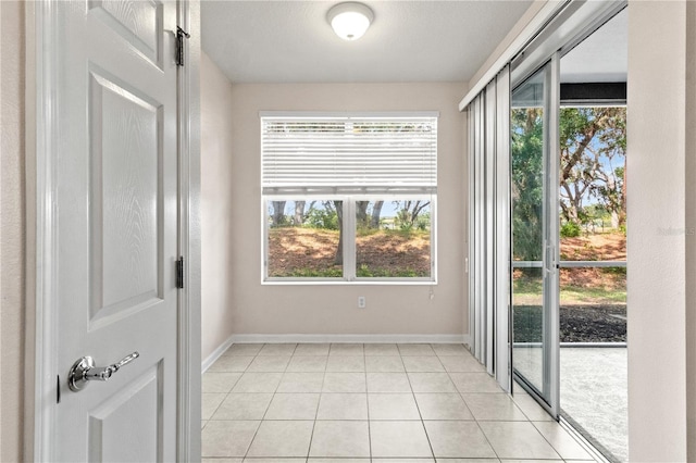 2009 River Turia Cir, Riverview, FL 33578 - empty room with light tile patterned flooring and baseboards