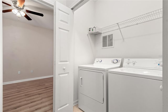 2009 River Turia Cir, Riverview, FL 33578 - washroom featuring laundry area, a ceiling fan, visible vents, light wood finished floors, and washer and dryer