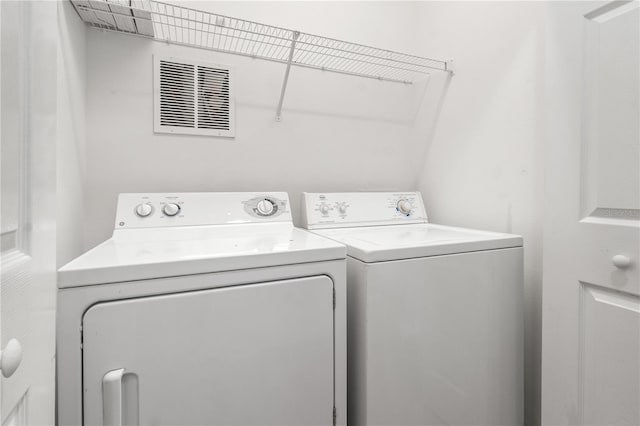 2009 River Turia Cir, Riverview, FL 33578 - laundry room featuring laundry area, washer and clothes dryer, and visible vents