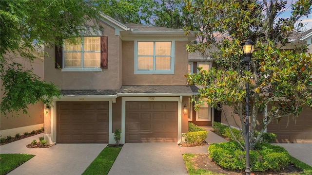 2009 River Turia Cir, Riverview, FL 33578 - view of front facade with a garage, driveway, and stucco siding