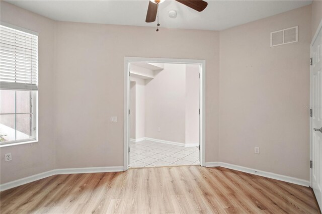 2009 River Turia Cir, Riverview, FL 33578 - unfurnished room with a ceiling fan, baseboards, visible vents, and light wood finished floors
