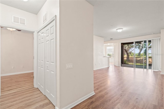 2009 River Turia Cir, Riverview, FL 33578 - corridor with baseboards, visible vents, and light wood finished floors
