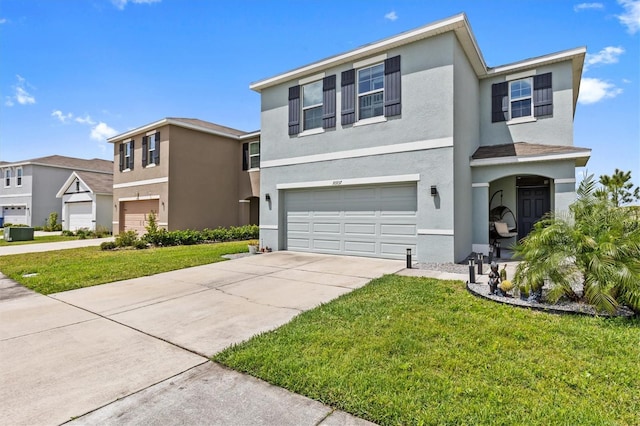 10937 Penny Gale Loop, San Antonio, FL 33576 - traditional-style home with an attached garage, driveway, stucco siding, and a front yard