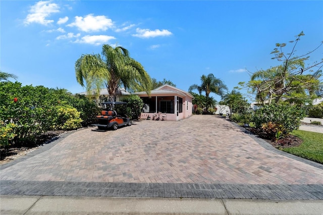 view of front of house with a sunroom