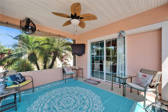 view of patio featuring ceiling fan
