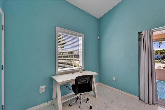 home office featuring baseboards and light tile patterned floors