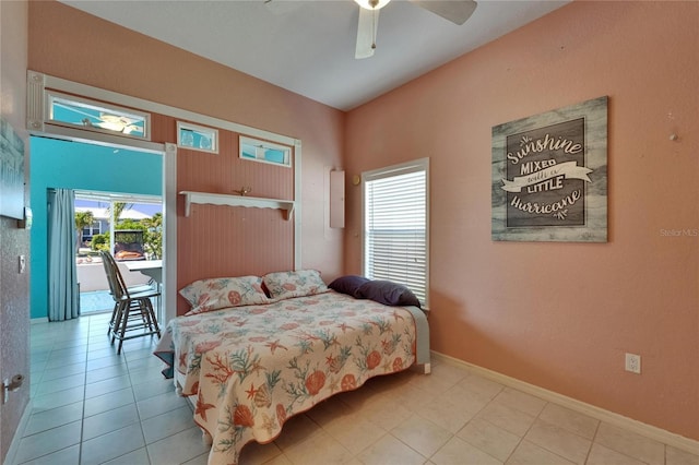 tiled bedroom featuring a ceiling fan, baseboards, and access to outside