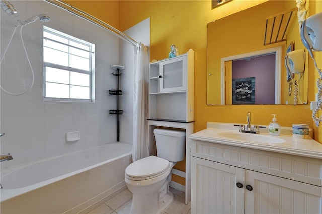 bathroom featuring shower / tub combo, toilet, vanity, and tile patterned floors