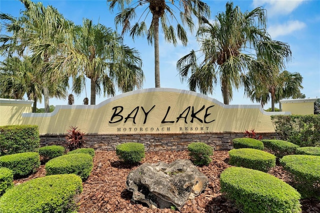 community sign featuring fence
